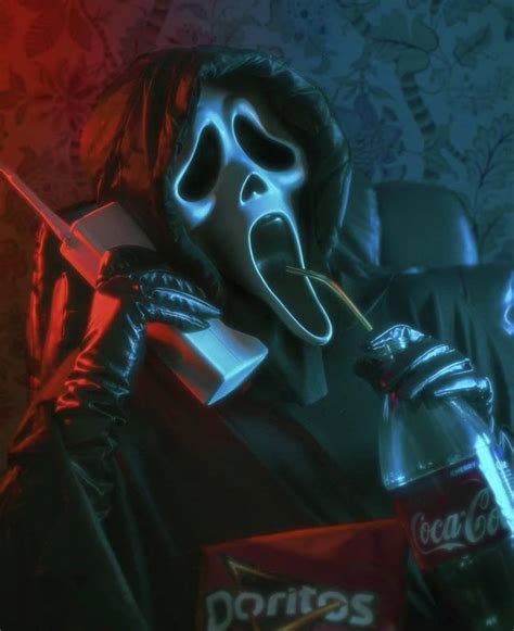 Ghost face contacting someone on the phone while drinking soda and eating chips